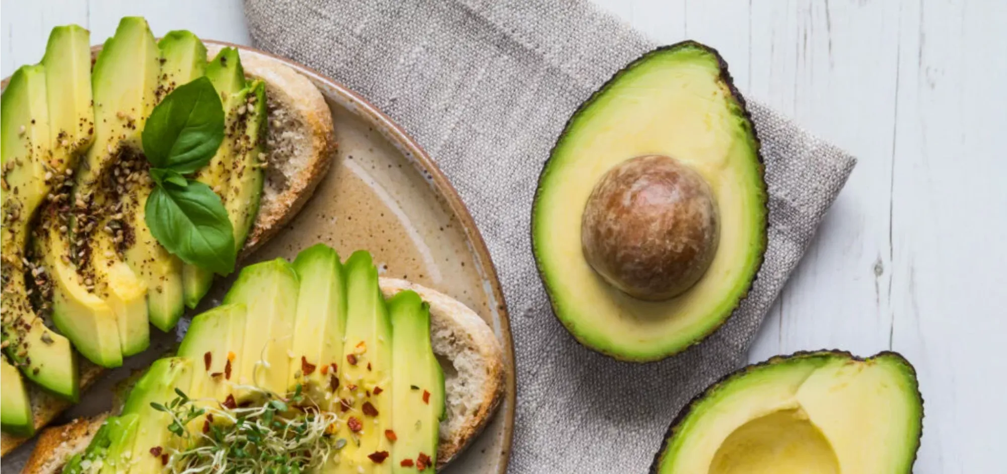 Avocados cut up on a chopping board